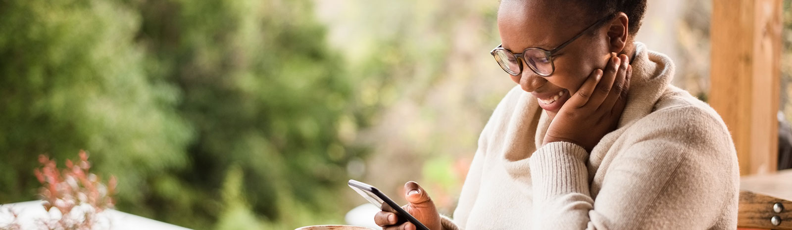 Lady using her smartphone in a restaurant