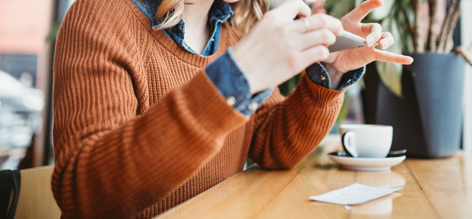 Lady using smartphone to make a mobile deposit