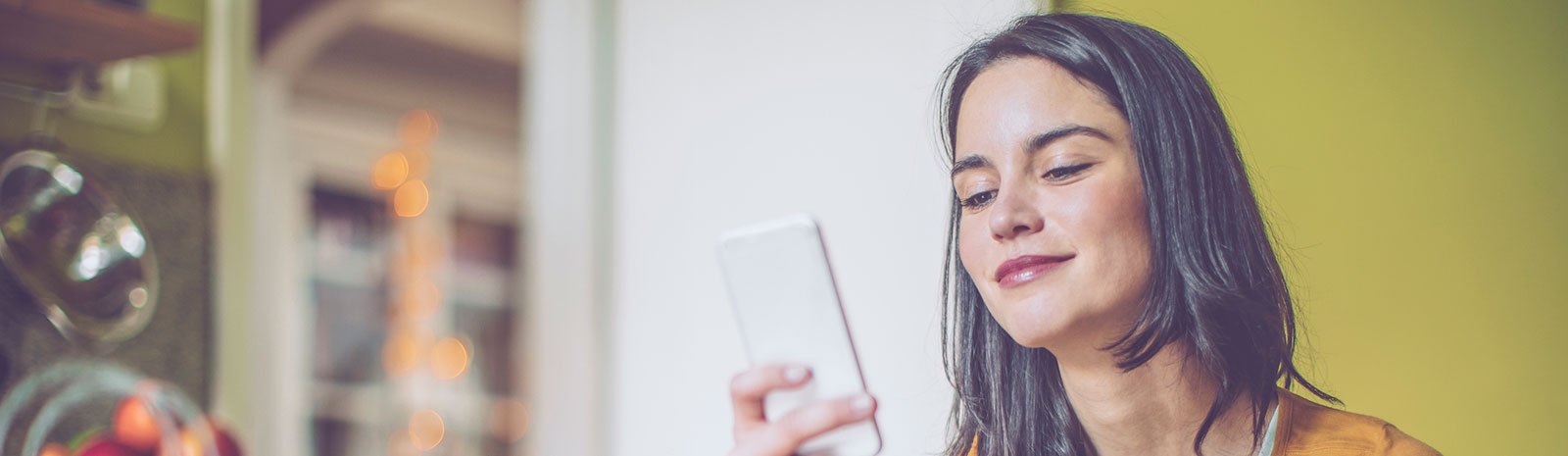 Lady using her smartphone at home